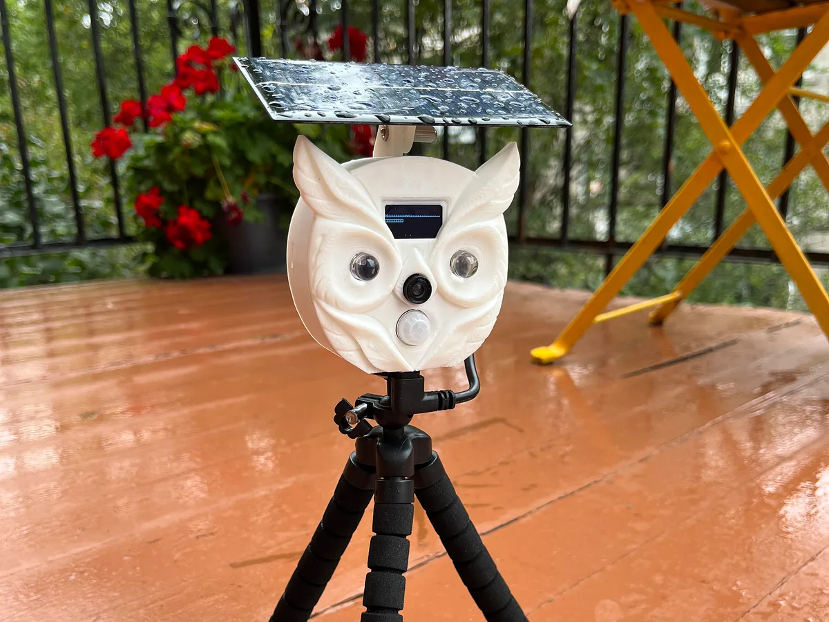 The BalconyPatrol prototype on its tripod on a wet balcony deck after rain